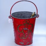 A George VI galvanised painted fire bucket, and 2 brass pokers