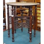 An Indian engraved brass-top table on folding base