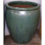 A large green glazed terracotta planter, W61cm