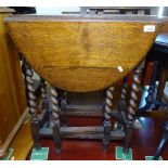 A small oak oval gateleg table, with barley twist legs, W62cm