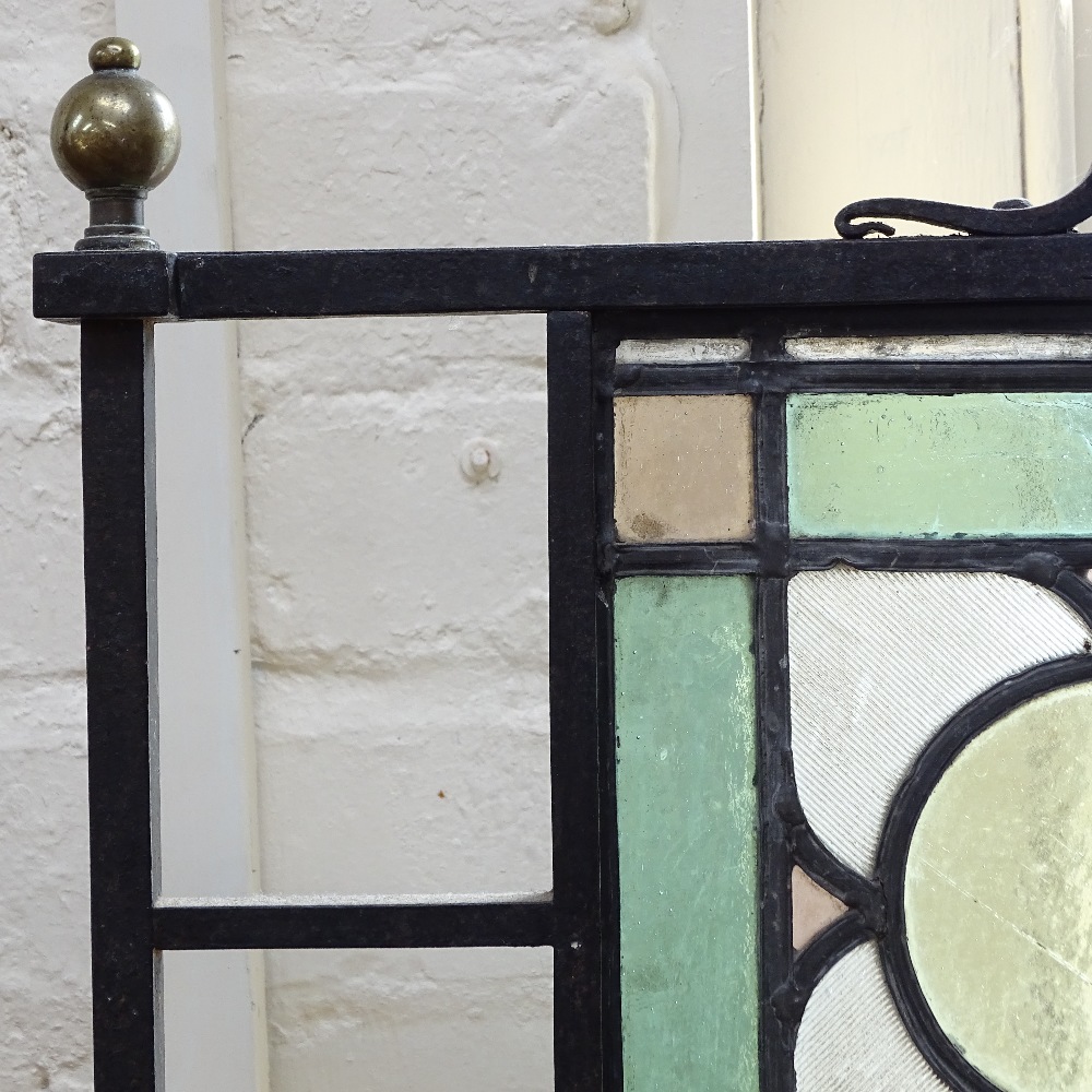 Antique wrought-iron framed firescreen, with leadlight glass panels and brass finials, height 28.5" - Image 2 of 2