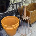 2 terracotta garden plant pots, and 2 wrought-iron plant stands