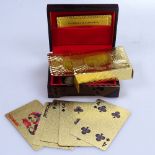 Cased 999.9 gold plated playing cards depicting $100 bills