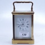 A French brass carriage clock, height 5", with key
