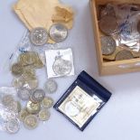 A box of various British coins, including £5 and £1