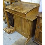 A polished pine clerk's writing desk with rising lid, W100cm