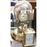 A brass 400-day clock under dome, and a French carriage clock, 4.5"