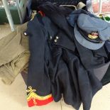 A suitcase with an Army Greatcoat, a Regimental tunic, caps etc