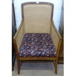 A 1920s rosewood-framed Bergere armchair