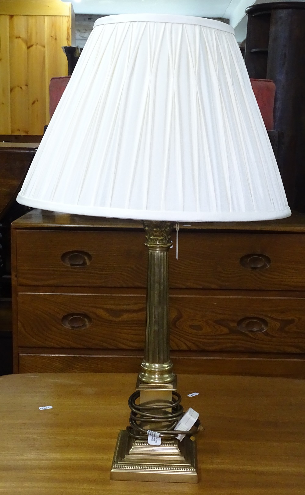 A brass Corinthian column table lamp and shade, height to top of shade 67cm