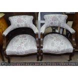 A pair of Edwardian upholstered bow armchairs, with mahogany show-wood