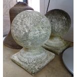 A pair of weathered stoneware ball finials, H34cm