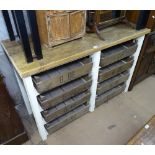 A polished and painted pine kitchen dresser base, with sliding apple crate drawers, L135cm, H91cm,