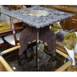 An ornate Indian carved rosewood square-top occasional table, on folding base, W65cm