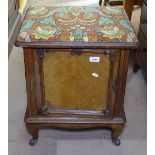 A small French walnut piano stool/cupboard, with upholstered seat and panelled door, on cabriole