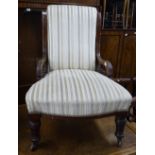 A Victorian upholstered and mahogany-framed nursing chair