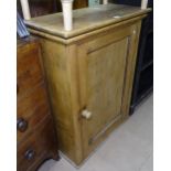 An Antique pine side cabinet with single panelled door, W74cm, H95cm