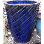 A spiral-turned blue glazed garden plant pot, H57cm