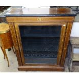 A Victorian rosewood and ebonised pier cabinet, with satinwood stringing and single glazed door,