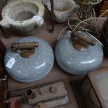 2 Antique curling stones with brass-mounted turned-wood handles, 9" diameter