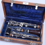 A cased First Class Hawkes & Son clarinet with plated mounts