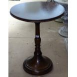 A circular polished oak pedestal side table, H69cm