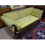 A Regency rollover arm upholstered settee, loose cushions, raised on turned fluted legs, L220cm