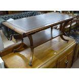 A Regency style mahogany 2-tier rectangular coffee table, with scrolled ends, inset with a skiver,