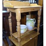 A polished pine washstand on turned legs, complete with wash jug and potty, W75cm