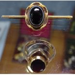 A 9ct gold and agate-set bar brooch, and a 9ct gold and garnet-set dress ring (2)