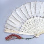 Antique finely carved and pierced Oriental ivory fan, with feather screen, length 11"