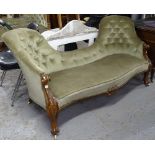A Victorian button-back upholstered and carved walnut-framed double spoon-back settee