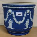 A Wedgwood dark blue Jasperware plant pot, with swag and lion mask decoration, height 8"