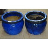 A pair of small blue glazed garden pots