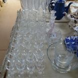 An engraved glass strawberry set, candlesticks, and various glasses