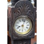 A miniature longcase clock in carved wood case, 12.75"