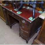 A mahogany twin-pedestal writing desk with fitted drawers, W107cm