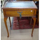An Edwardian mahogany and satinwood-banded vitrine display table, raised on cabriole legs, W64cm,