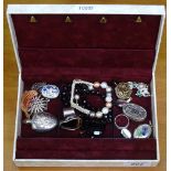A miniature scent bottle, enamel lockets, small silver pill box, and costume jewellery