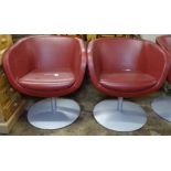 A pair of swivel Club chairs