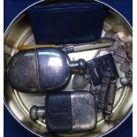 2 silver plated and mounted hip flasks, coin set brooches, a Metropolitan Police whistle,