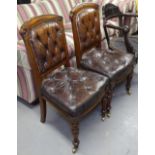 A pair of Victorian walnut and leather upholstered side chairs