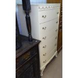 A cream painted bow-front chest of 6 shorts drawers, W70cm