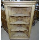 A Victorian polished pine open corner cabinet, with shaped shelves, W90cm, H140cm