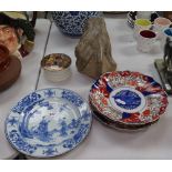 A Chinese blue and white plate, 9", 3 Imari plates, a stone sculpture of a hand, and a polychrome