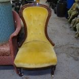 A Victorian walnut-framed and upholstered nursing chair