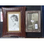 A rectangular silver-fronted photo frame, and a leather covered photo frame