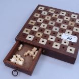 Inlaid travelling chess set with bone and wood pieces