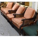 A 1920s mahogany-framed Bergere suite, comprising of a 2-seater settee, and a pair of matching