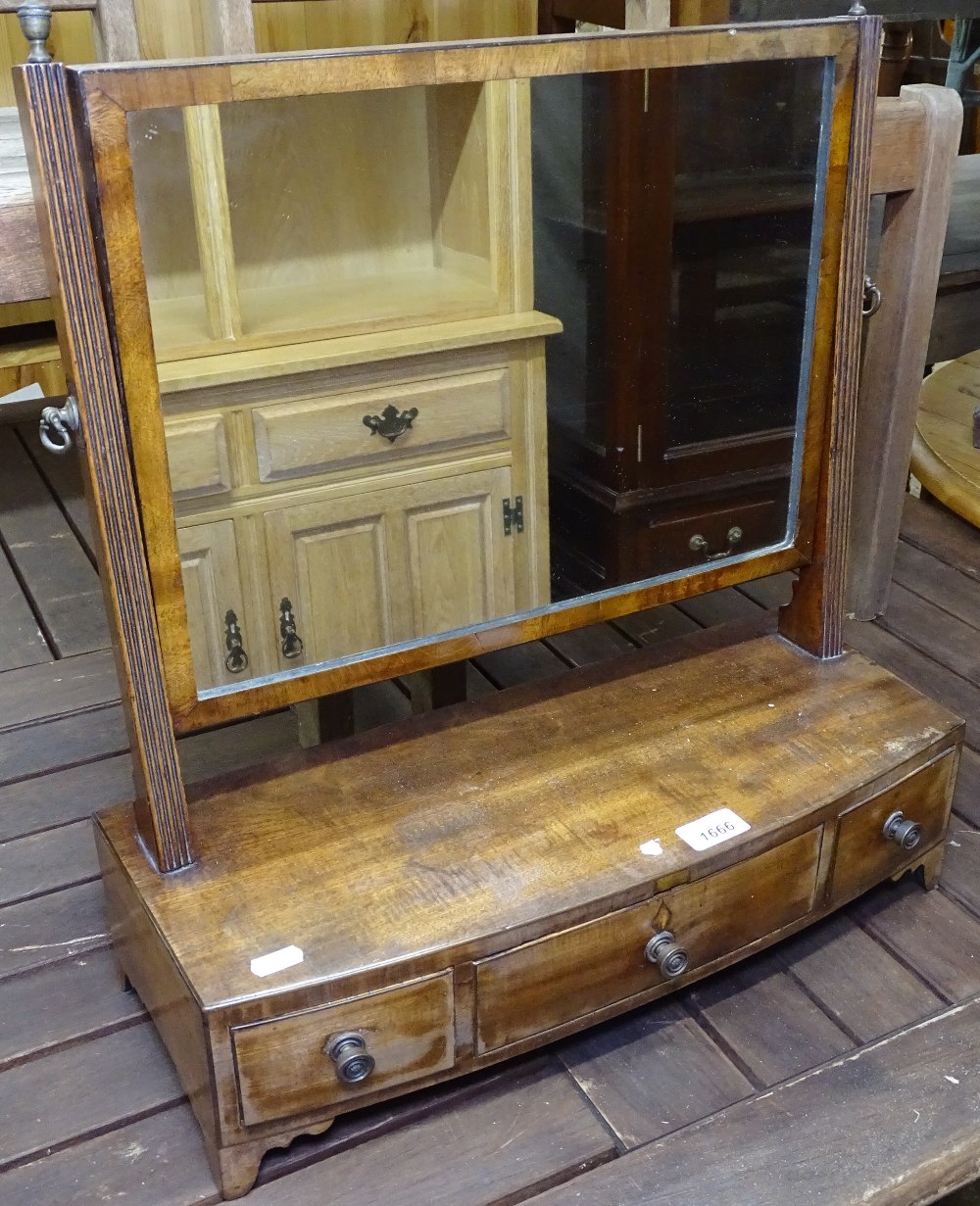 A 19th century mahogany bow-front swing toilet mirror, with 3 short drawers, W50cm